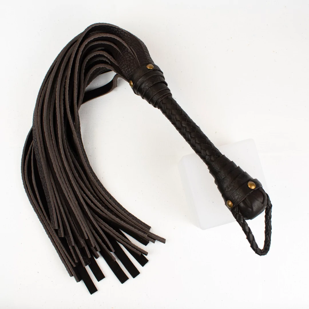 Image shows a black leather flogger
